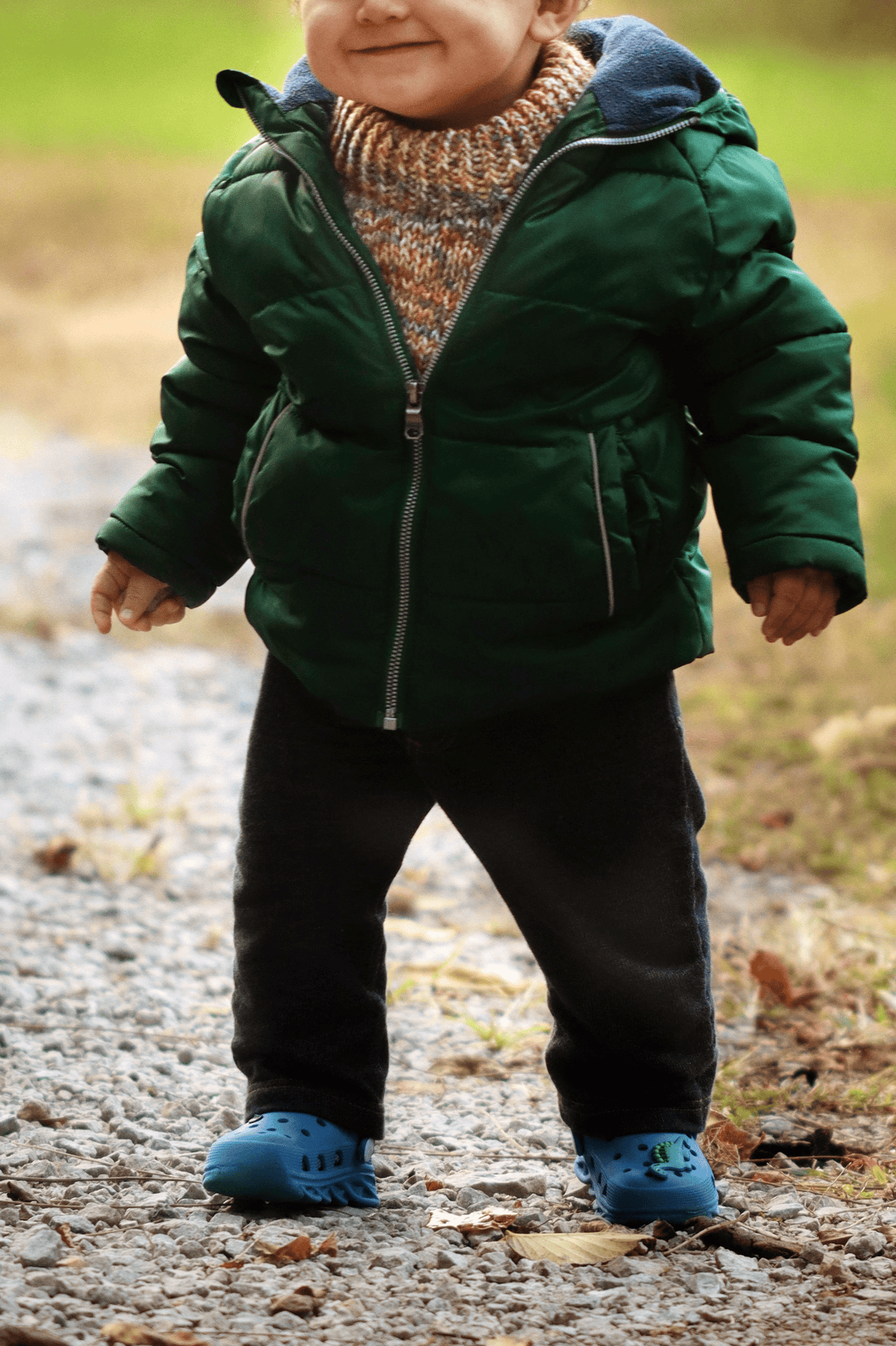 Folded cream knit toddler dickey showing texture and construction details