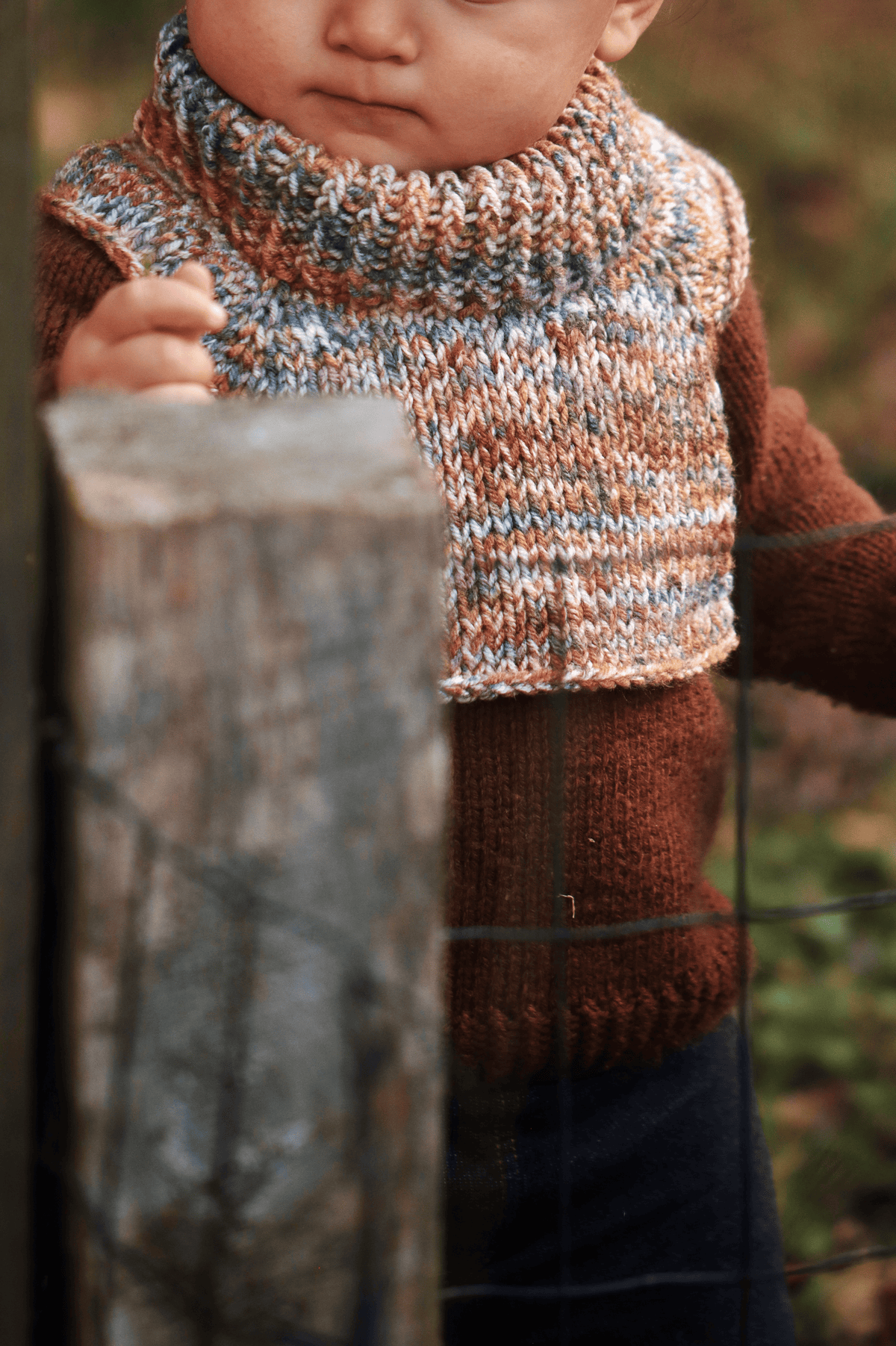 Cream colored knitted toddler dickey neck warmer flat lay on white background