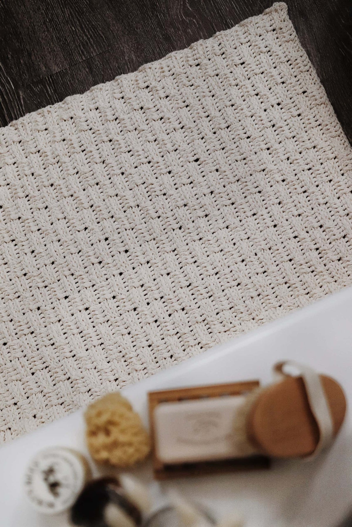 Soft underfoot crocheted bath mat with classic woven design