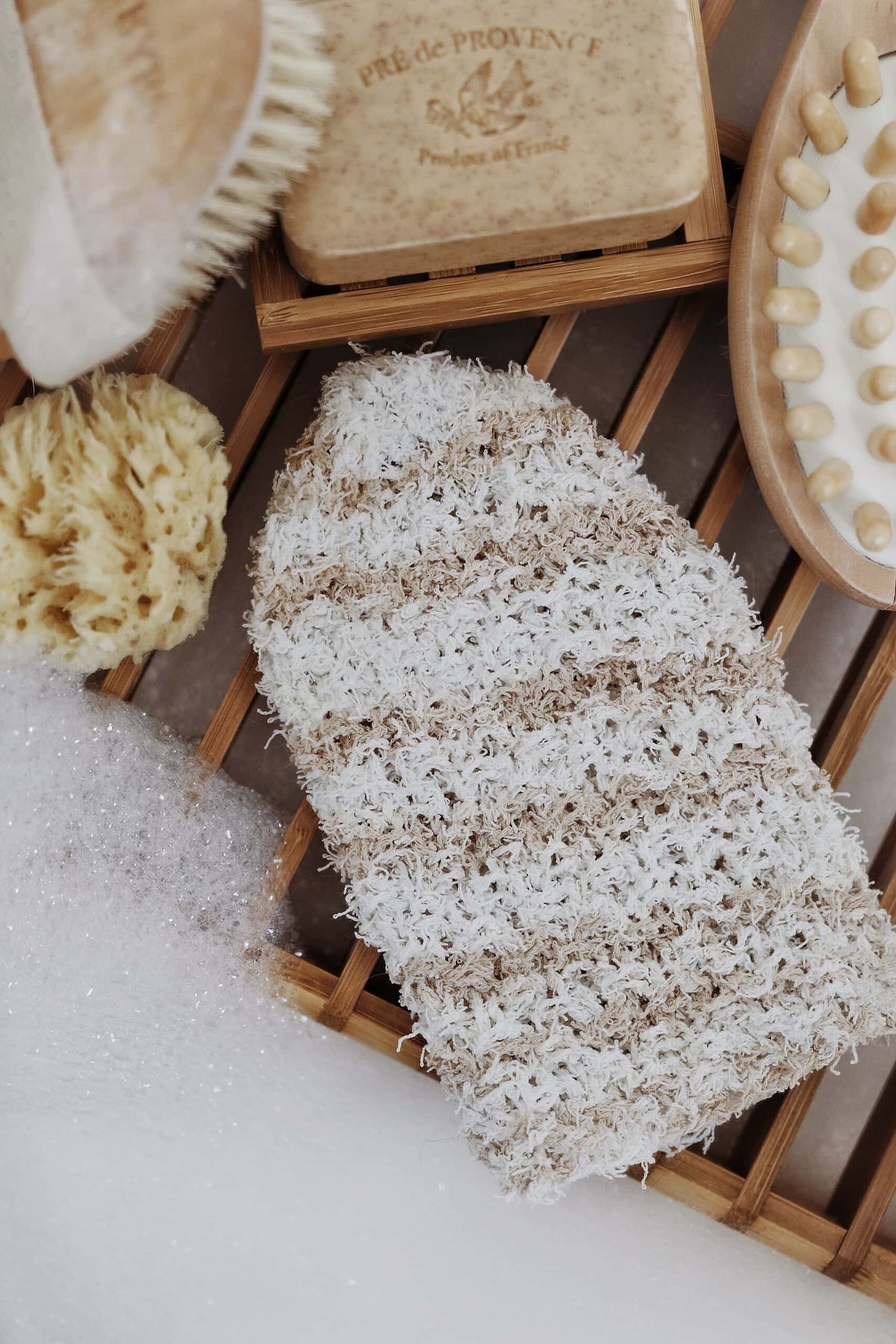 Handknit pebble wash cloths and bath mitt in natural cotton yarn with textured moss stitch pattern