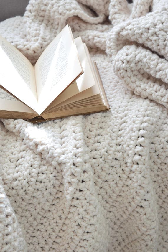 Thick chunky crochet throw blanket pattern showing luxurious texture and drape