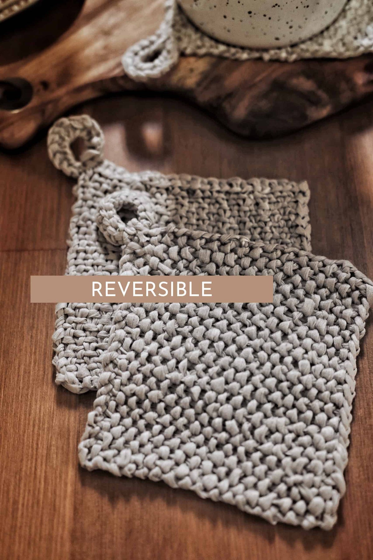 Reversible knit coaster showing woven texture side and nubby textured reverse side