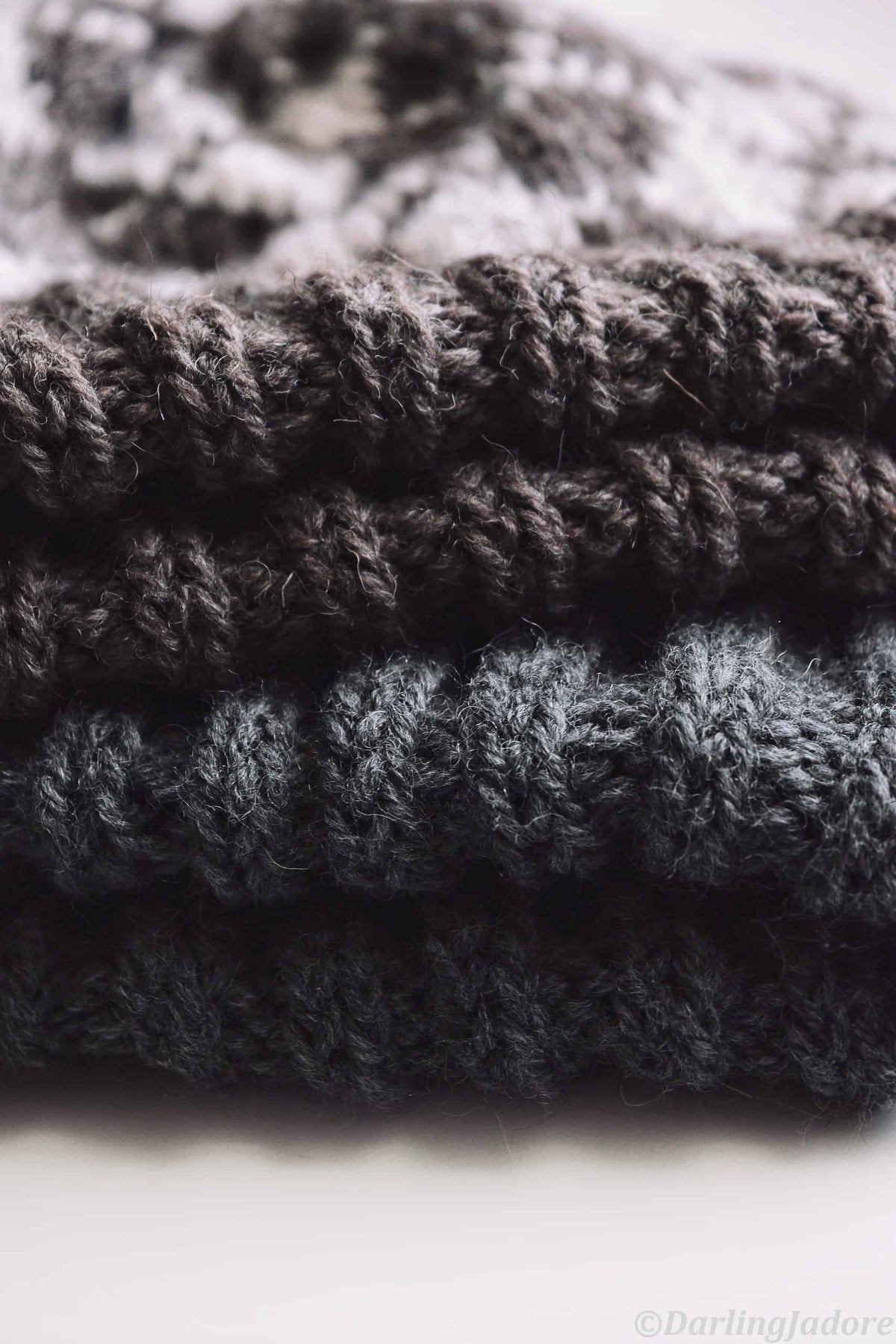 Close-up of argyle beanie knitting pattern showing detailed fair isle colorwork and texture
