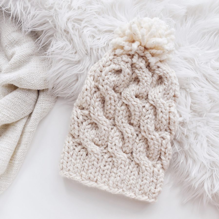 Back view of cable beanie knitting pattern showing classic ribbed brim construction