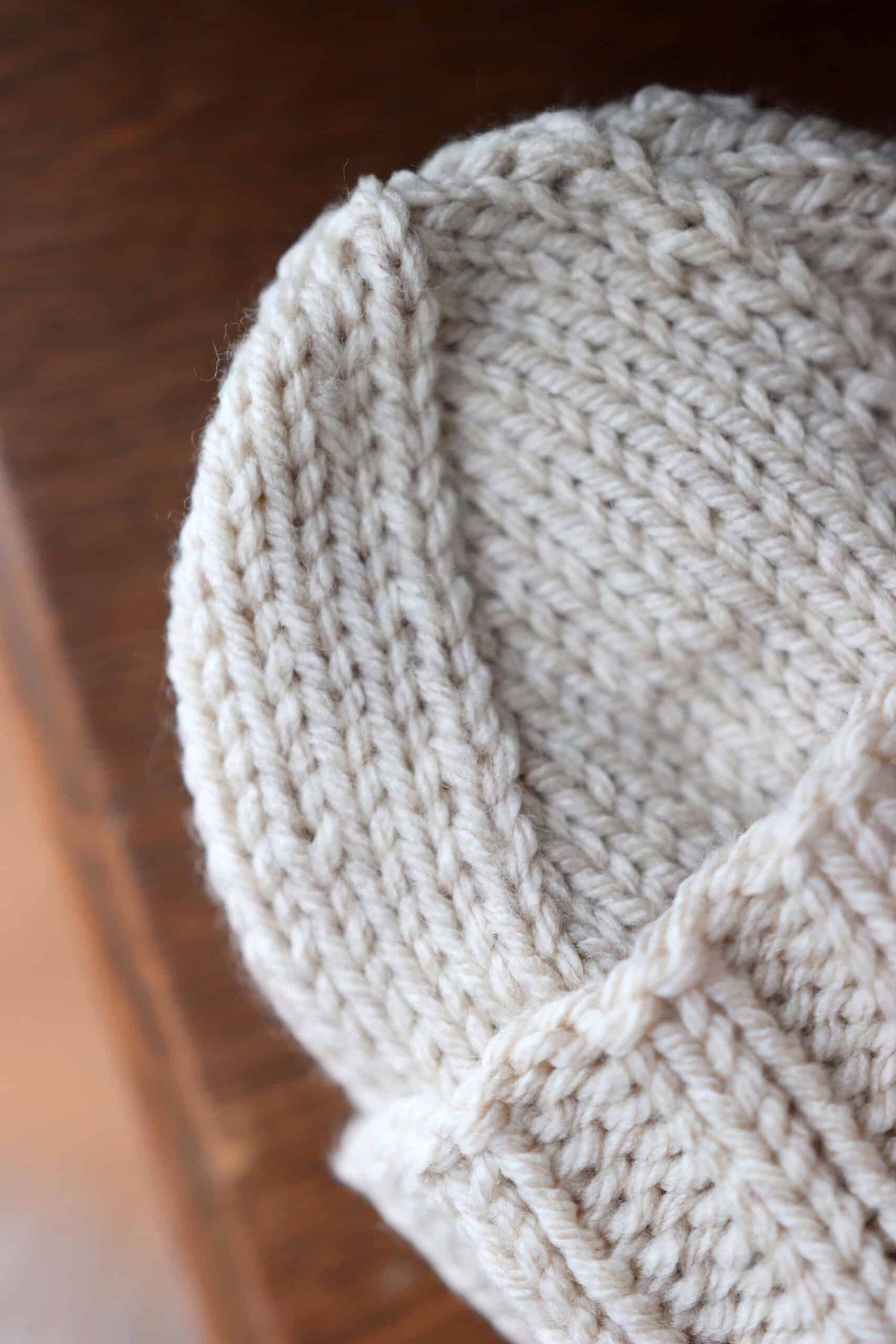 Newborn hat knitting pattern with ribbed fold-up brim detail