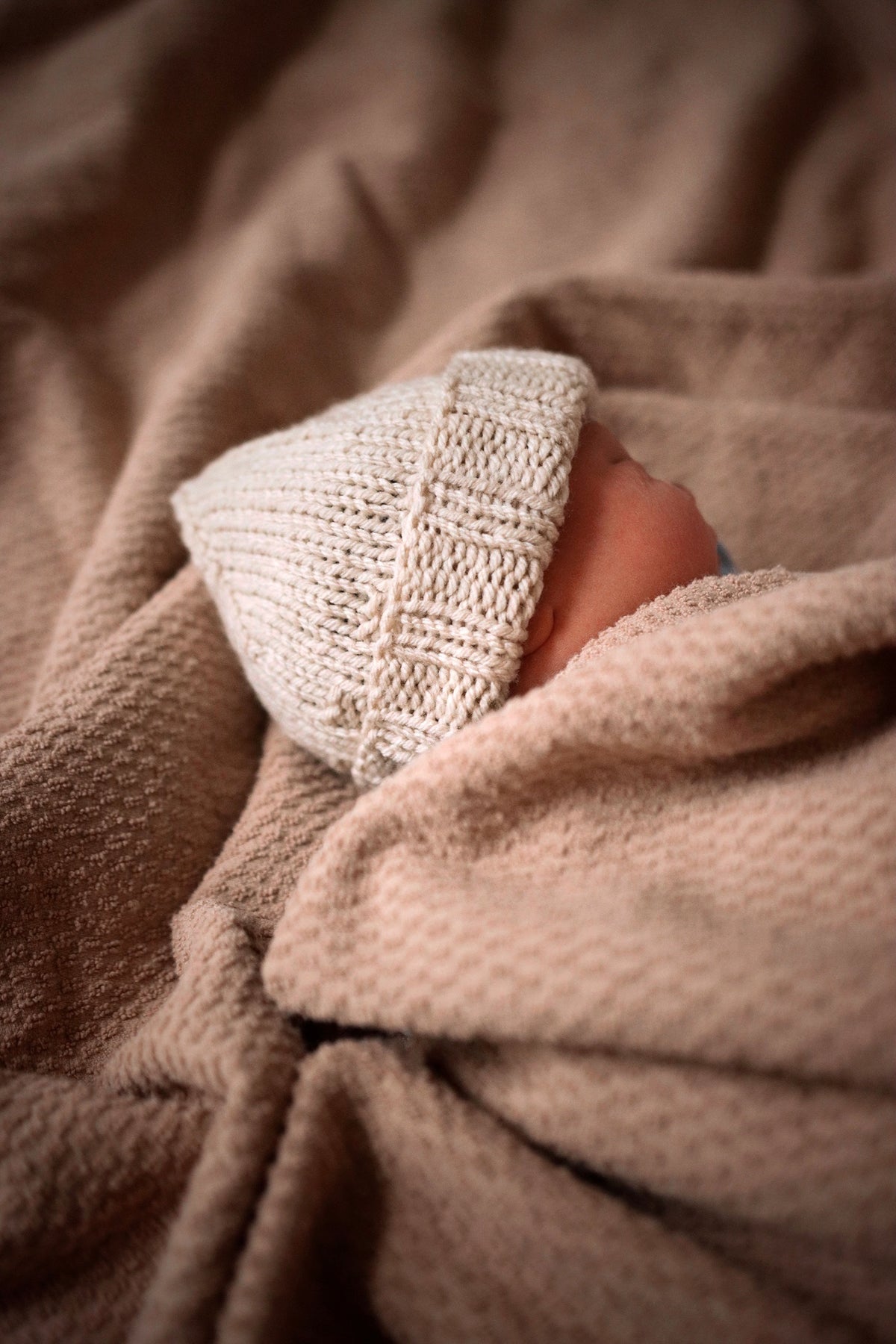 Cute hand-knit baby beanie hat in soft merino wool