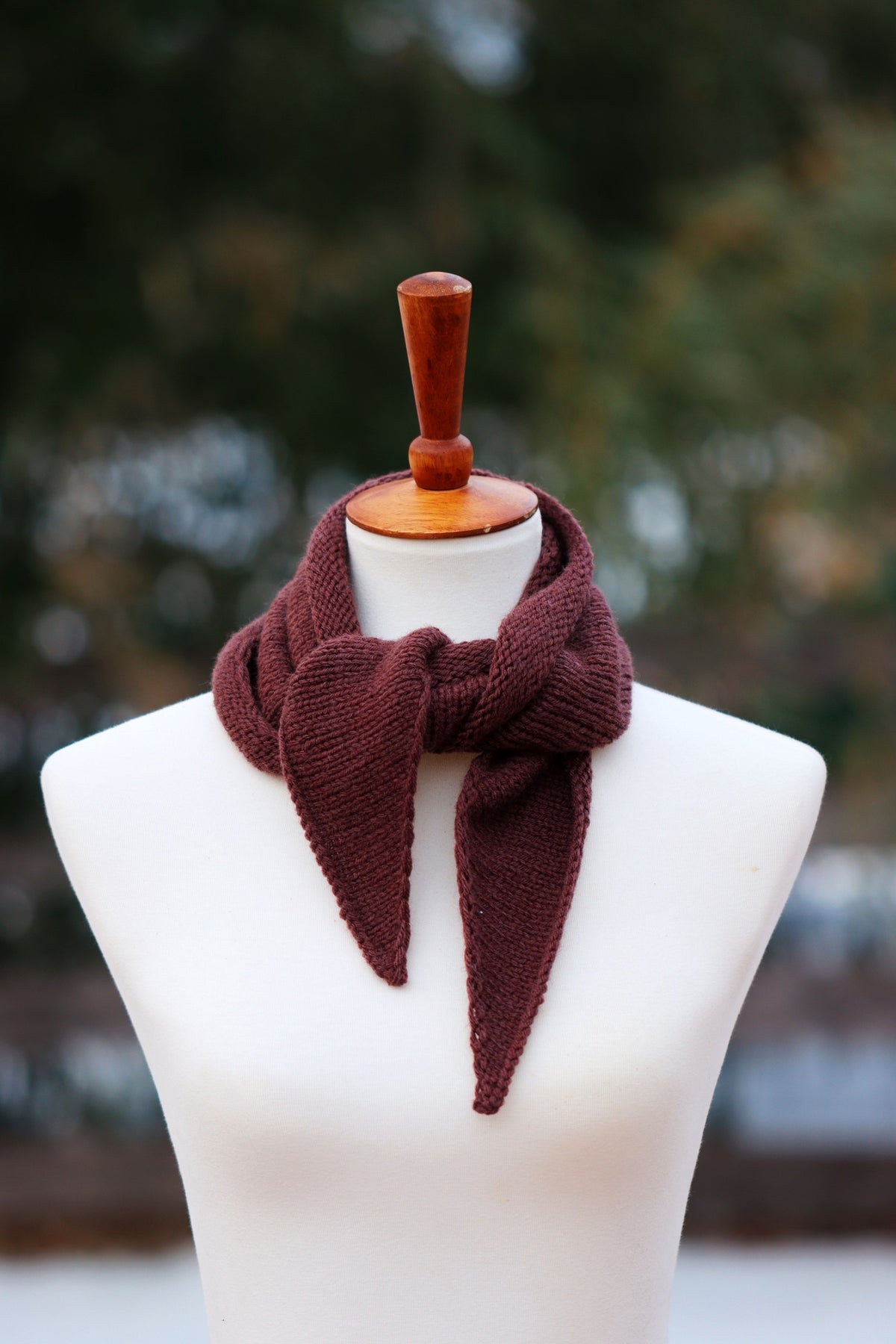 Small bandana scarf knitted in cream yarn draped elegantly - The Air Scarf petite knitting pattern by Darling Jadore