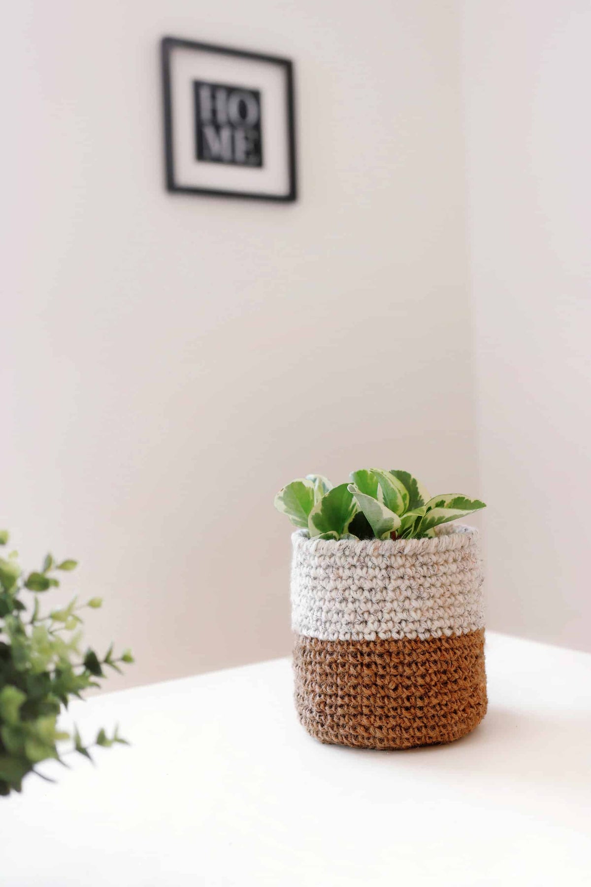Crochet storage basket pattern featuring natural jute texture perfect for organizing nursery toys