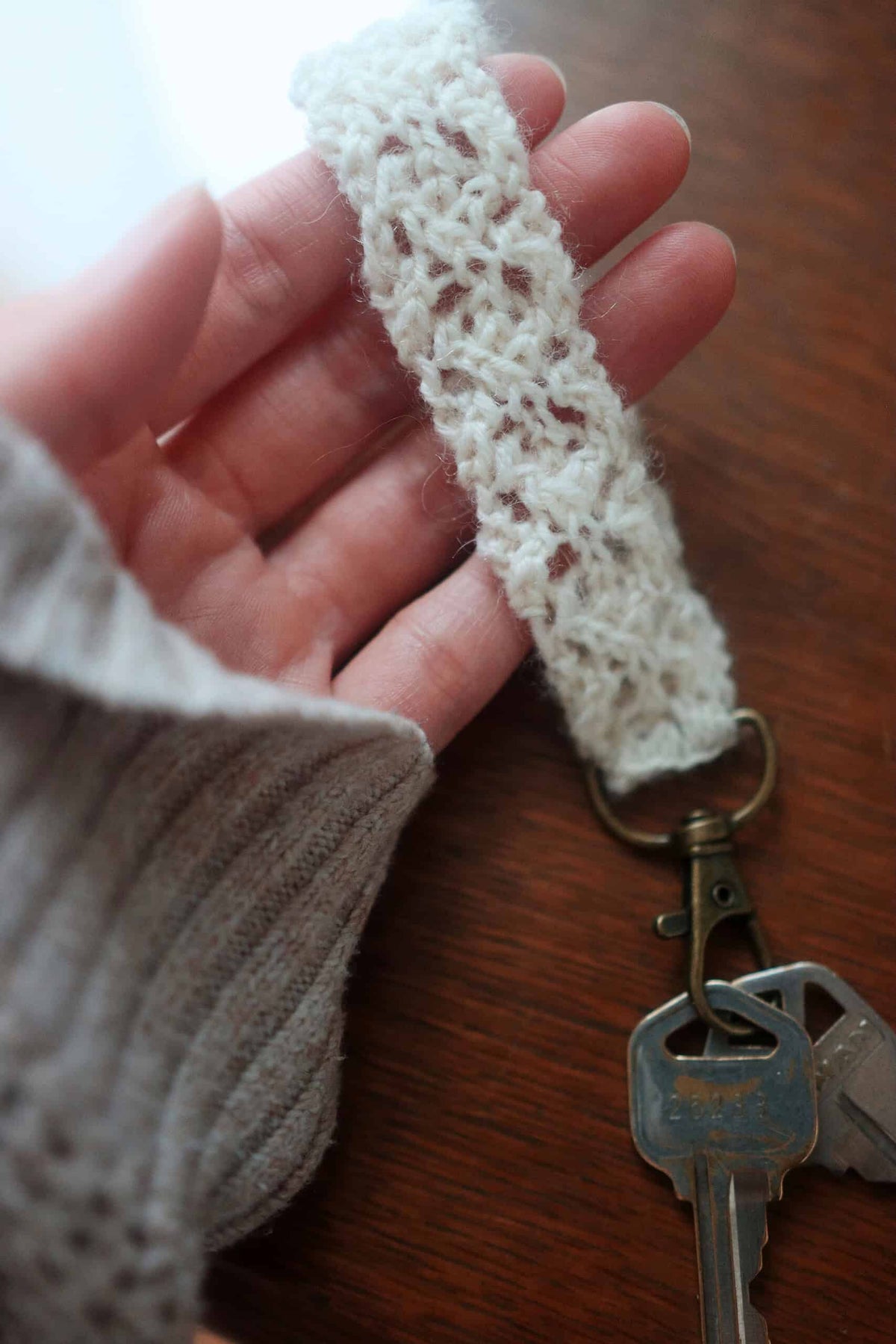 Beginner lace knitting pattern for durable and elegant keychain accessory