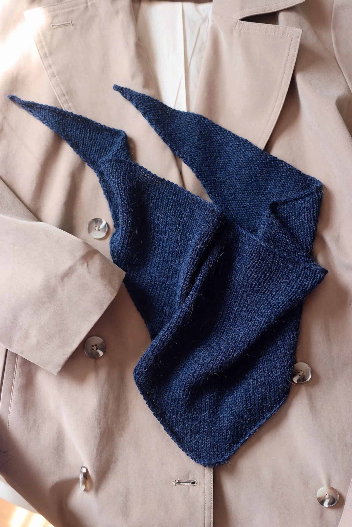 Beginner triangle shawl knitting pattern showing elegant minimalist design