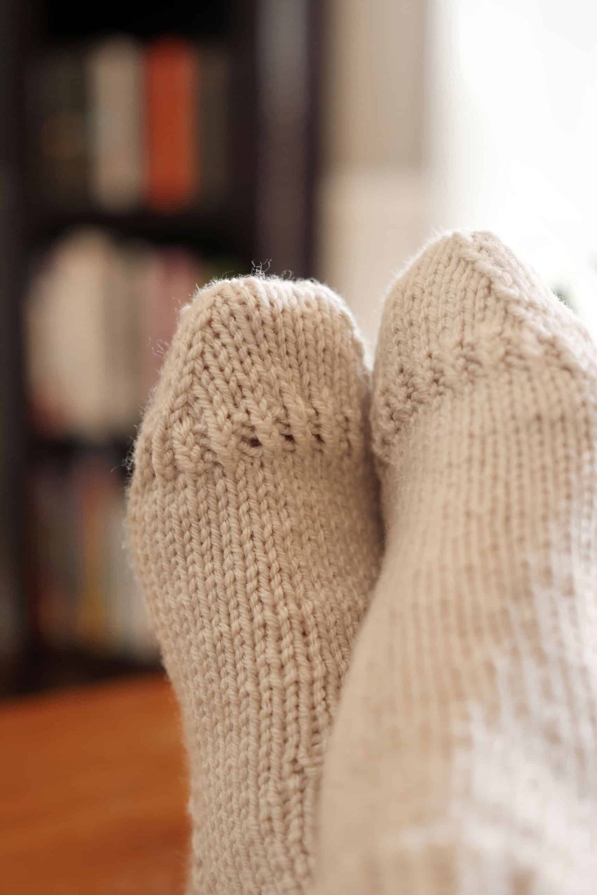 Easy worsted weight socks knitting pattern for women in neutral cream