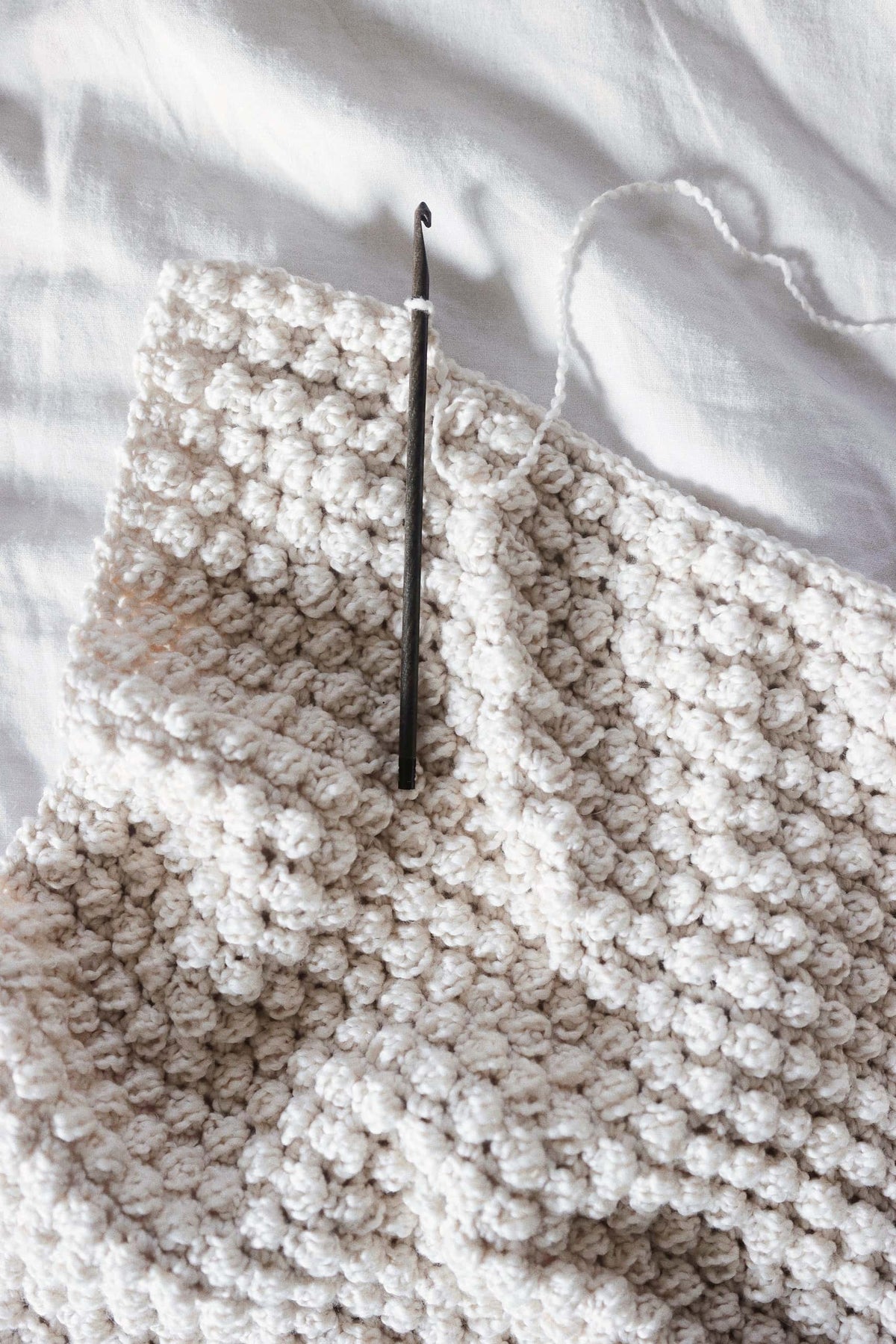 Beginner friendly bobble crochet kitchen towel pattern in sustainable cotton yarn