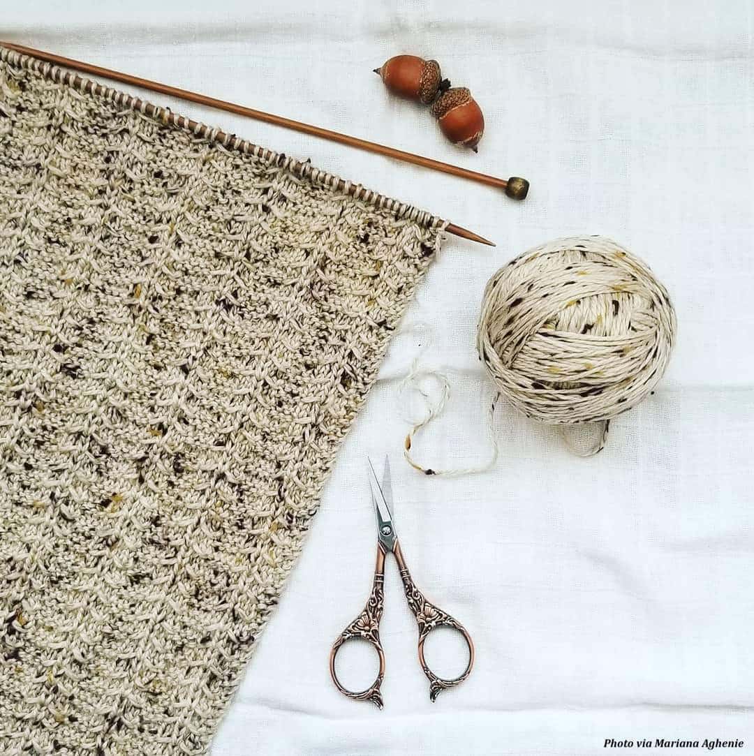 The Breck Scarf knitting pattern flat lay showing full length and textured stitch work