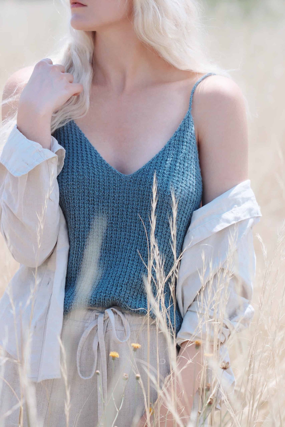 Summer camisole knitting pattern in blue with textured knit purl stitch detail
