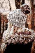 The Cedar Beanie cable knit hat pattern with fold-up brim in cream yarn
