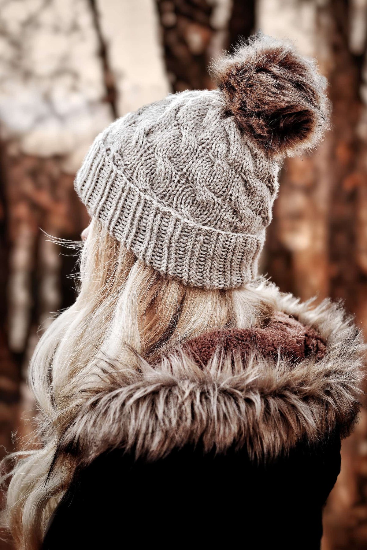 The Cedar Beanie cable knit hat pattern with fold-up brim in cream yarn