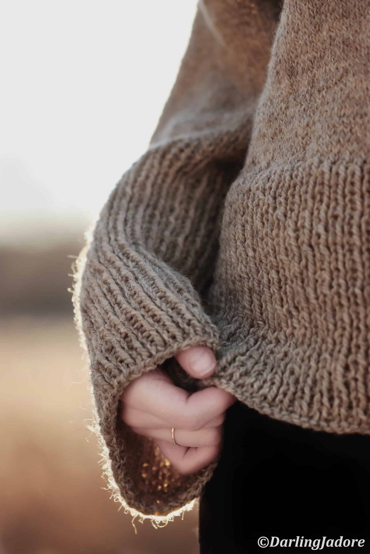 Beginner-friendly comfort sweater knitting pattern in chunky cream yarn