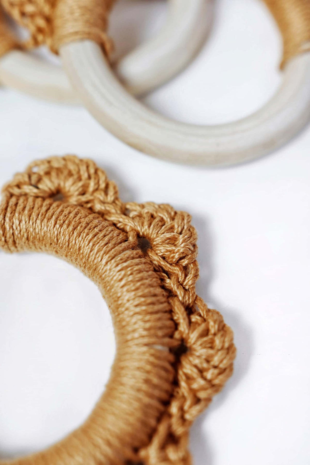 Easy crochet baby teether toy pattern with wooden ring and soft yellow cotton yarn