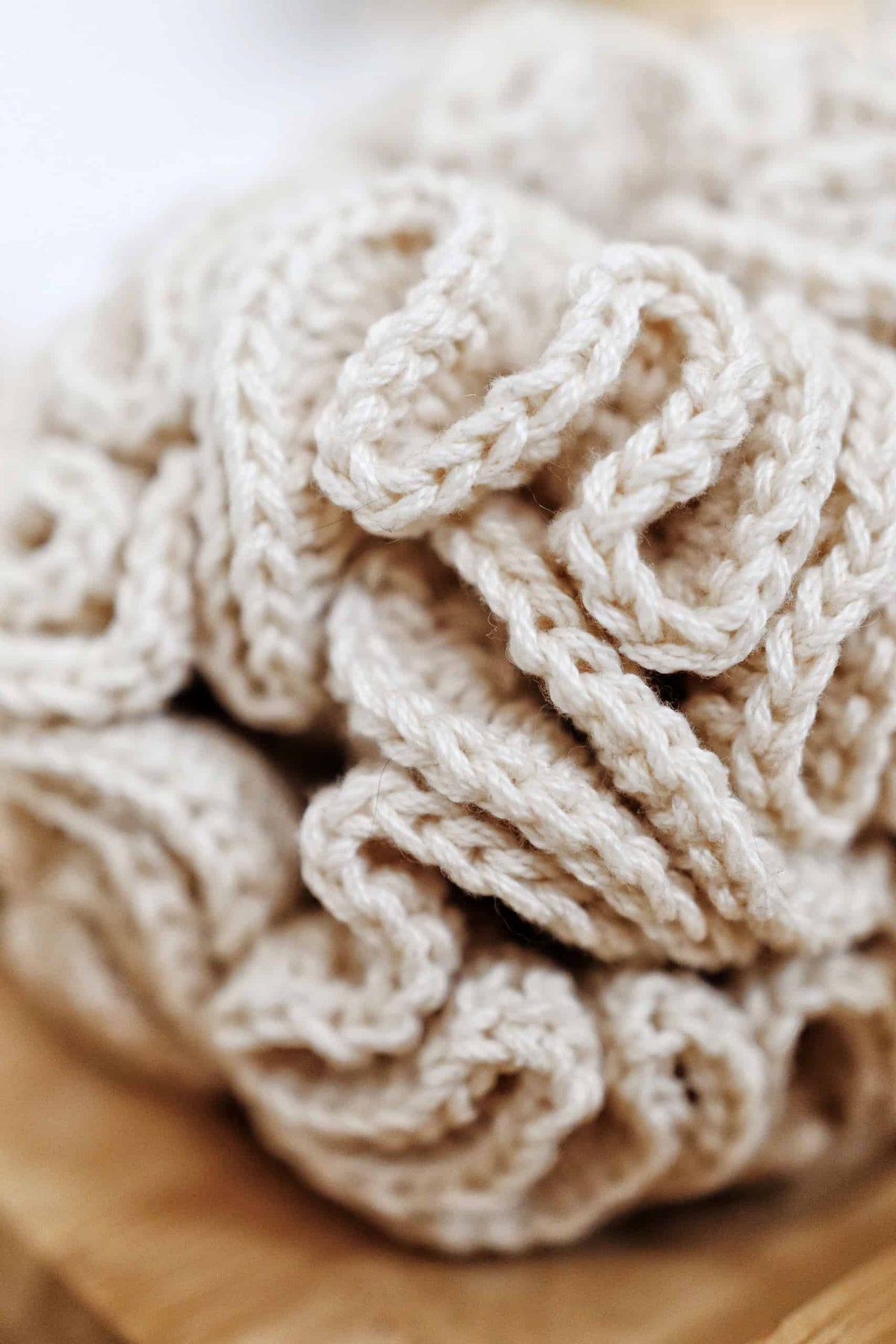 Handmade crochet loofah bath sponge pattern showing texture and lather