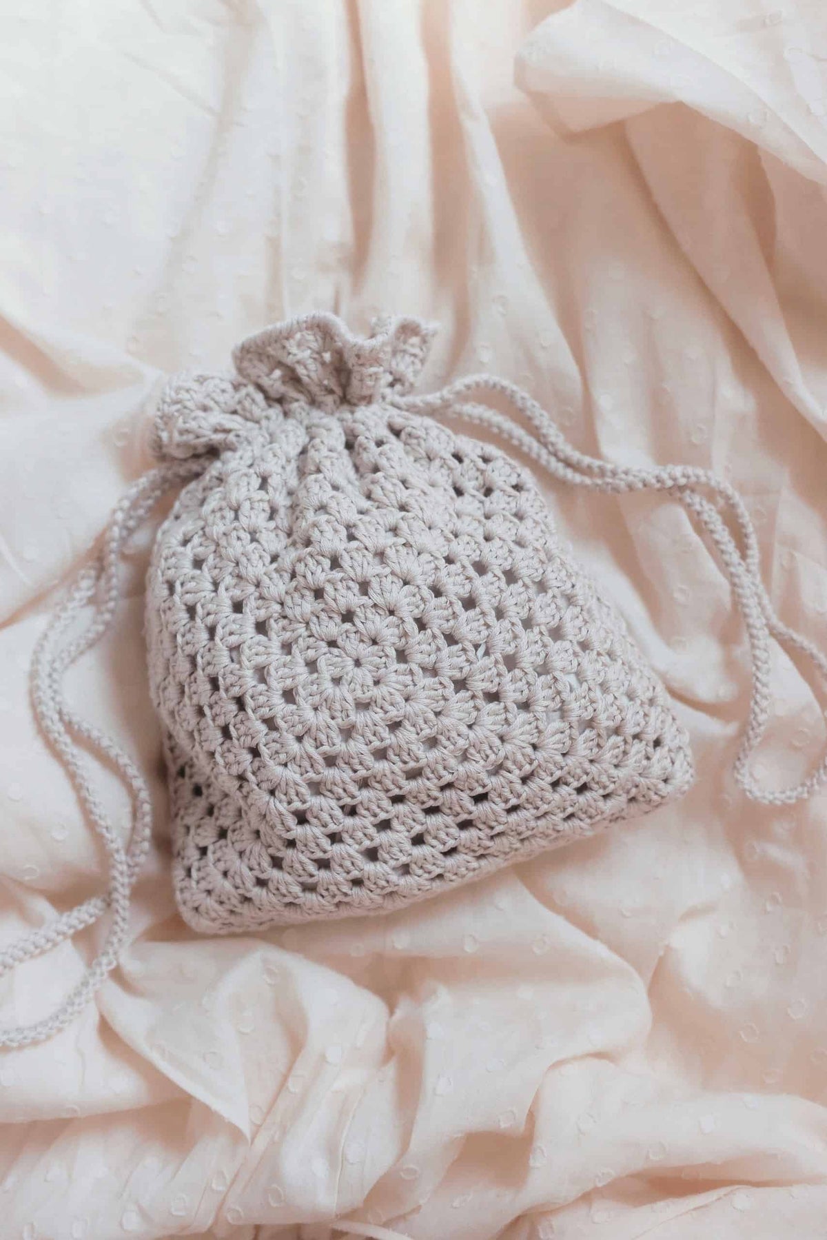 Classic crochet purse pattern with elegant drawstring design detail
