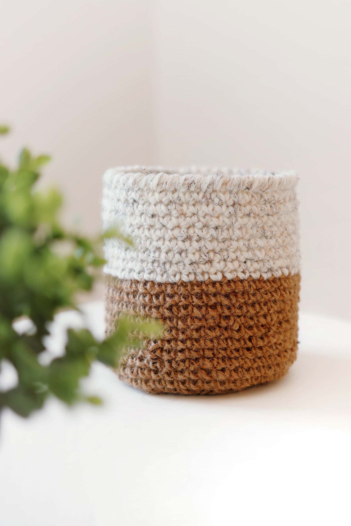 Small crochet basket pattern in jute with customizable sizing instructions for home storage