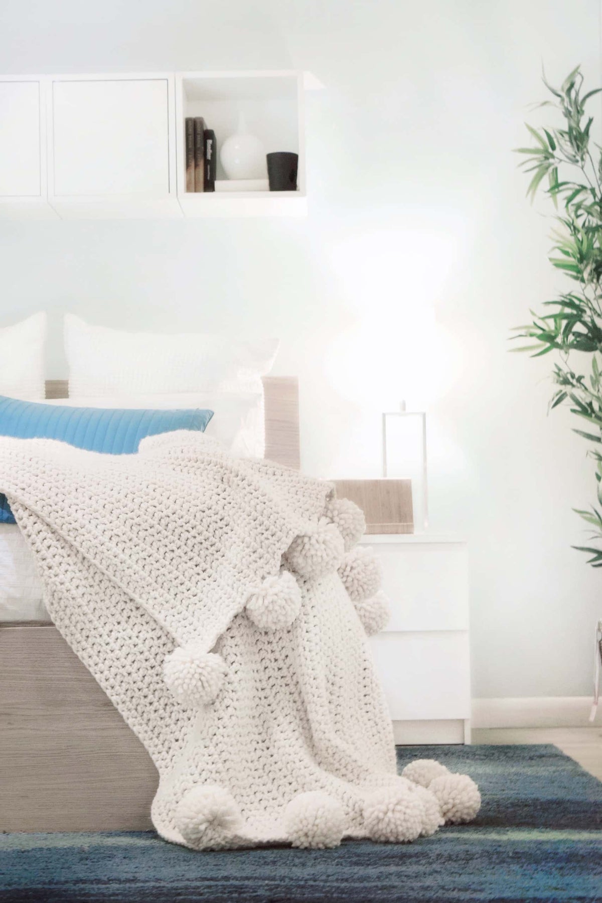 Beginner friendly chunky afghan crochet pattern styled as cozy throw blanket in neutral home setting