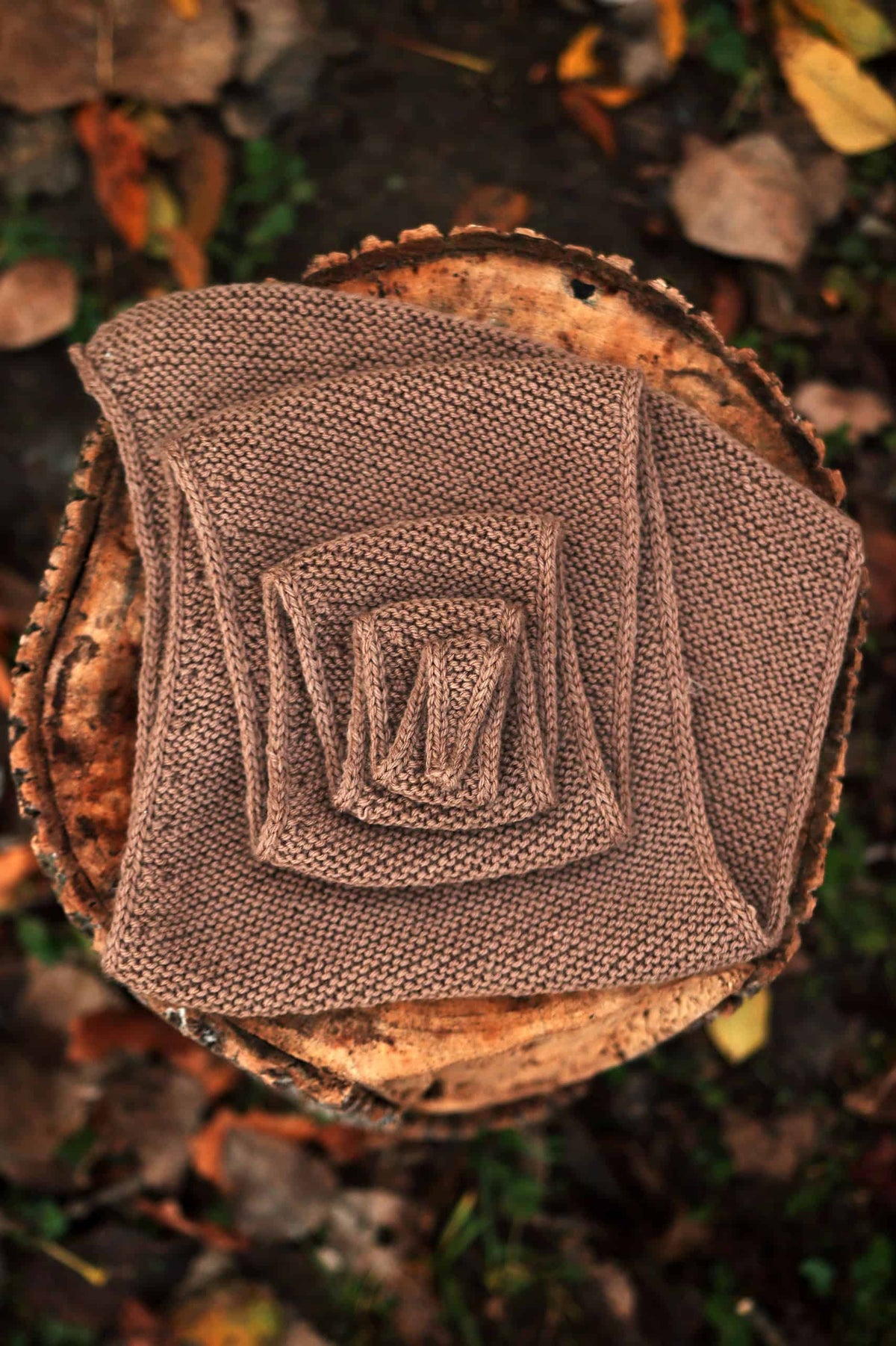 Easy beginner scarf knitting pattern with garter stitch texture in neutral tones