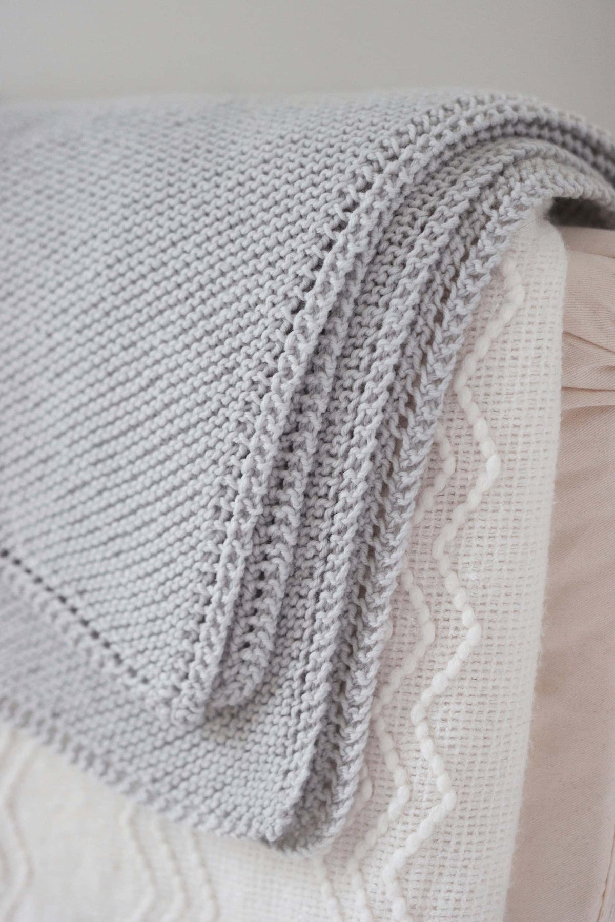 Easy baby blanket knitting pattern folded to show timeless texture and simple elegance