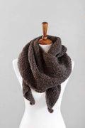 The Canyon Scarf asymmetrical boomerang scarf knitting pattern draped elegantly showing unique shape