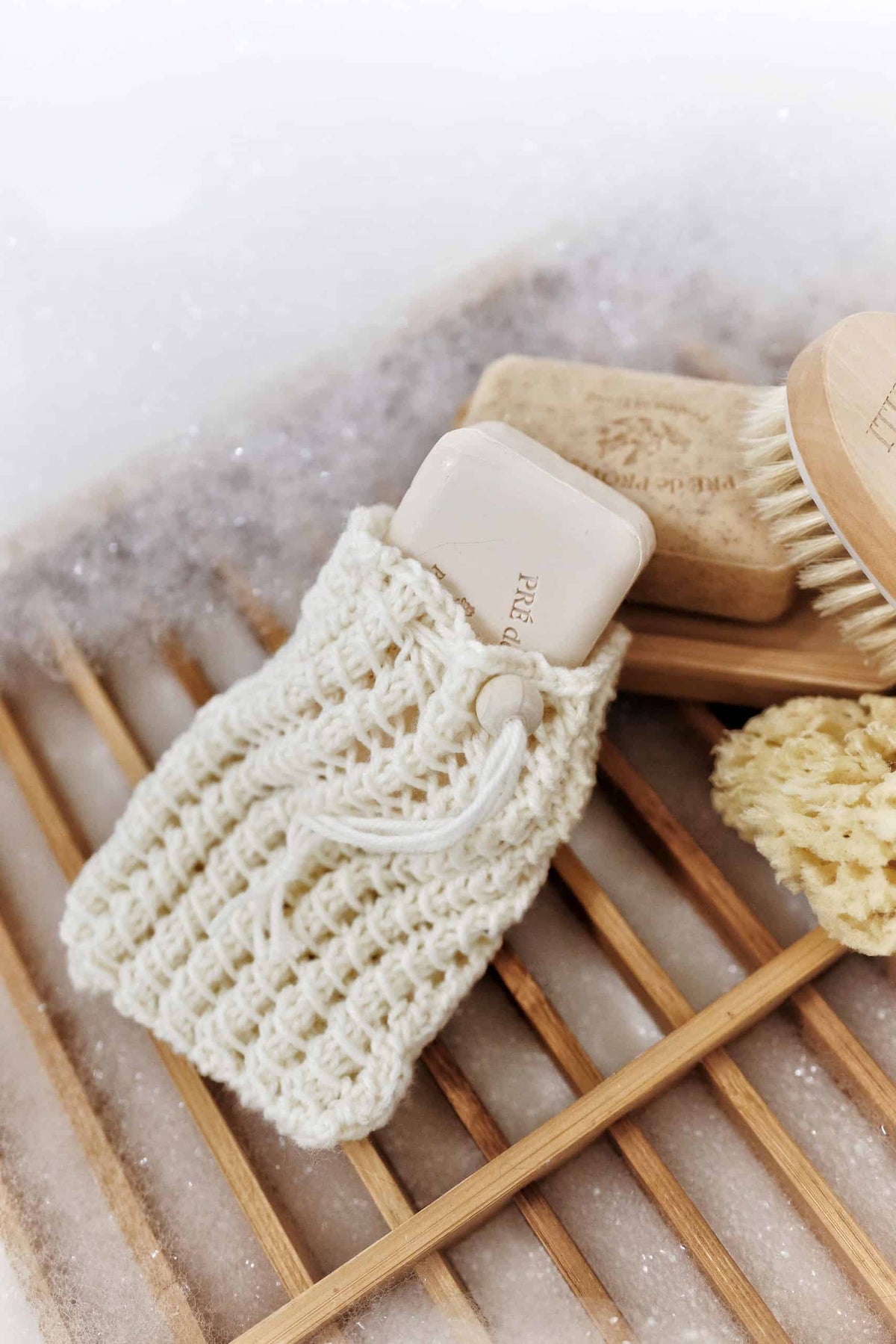 Handmade knit soap bag pattern with open lace stitches for maximum lather and soap longevity