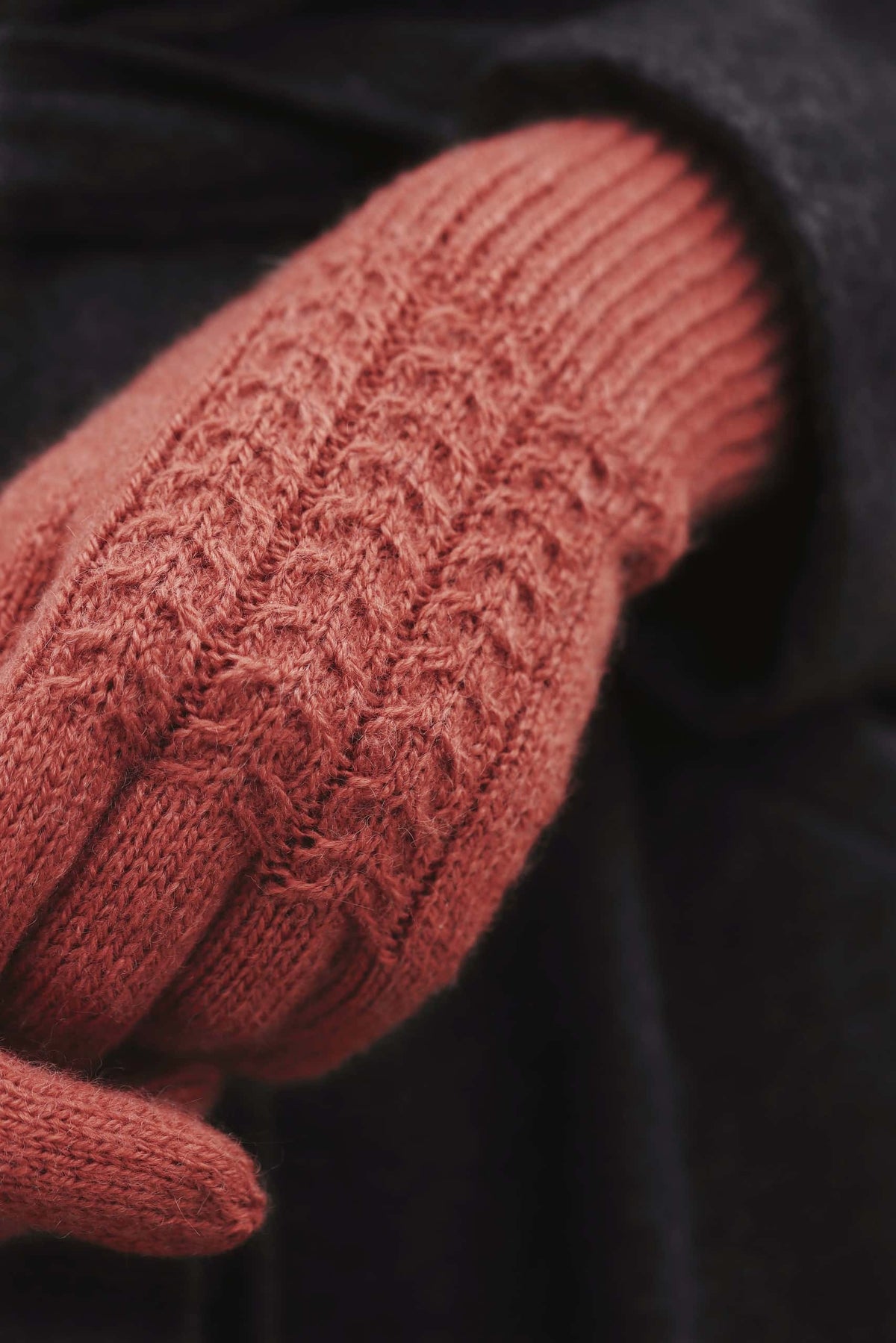 Juniper gloves knitting pattern in cream showing sophisticated cable knit design