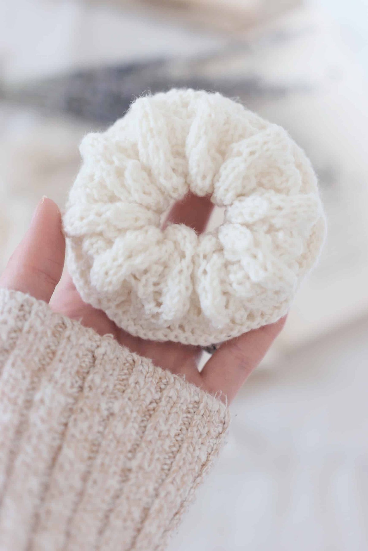 Hair scrunchie knitting pattern showing gathered lace fabric in natural light