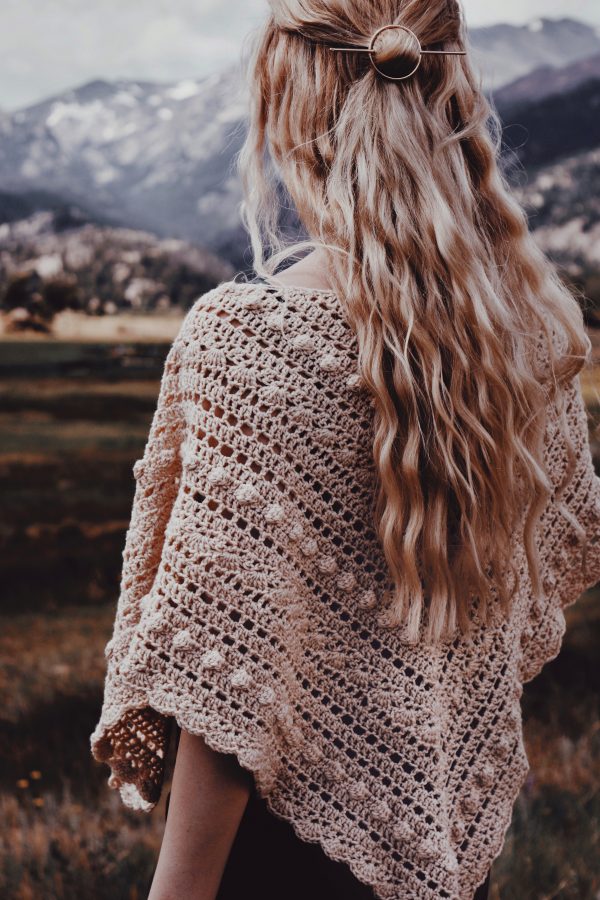 Close-up of vintage-inspired lace triangle shawl with intricate bobble texture - Isla Scarf crochet pattern