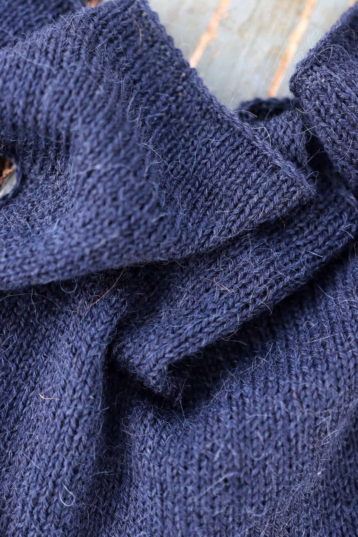 Small neck kerchief knitting pattern styled to show versatile wearing options