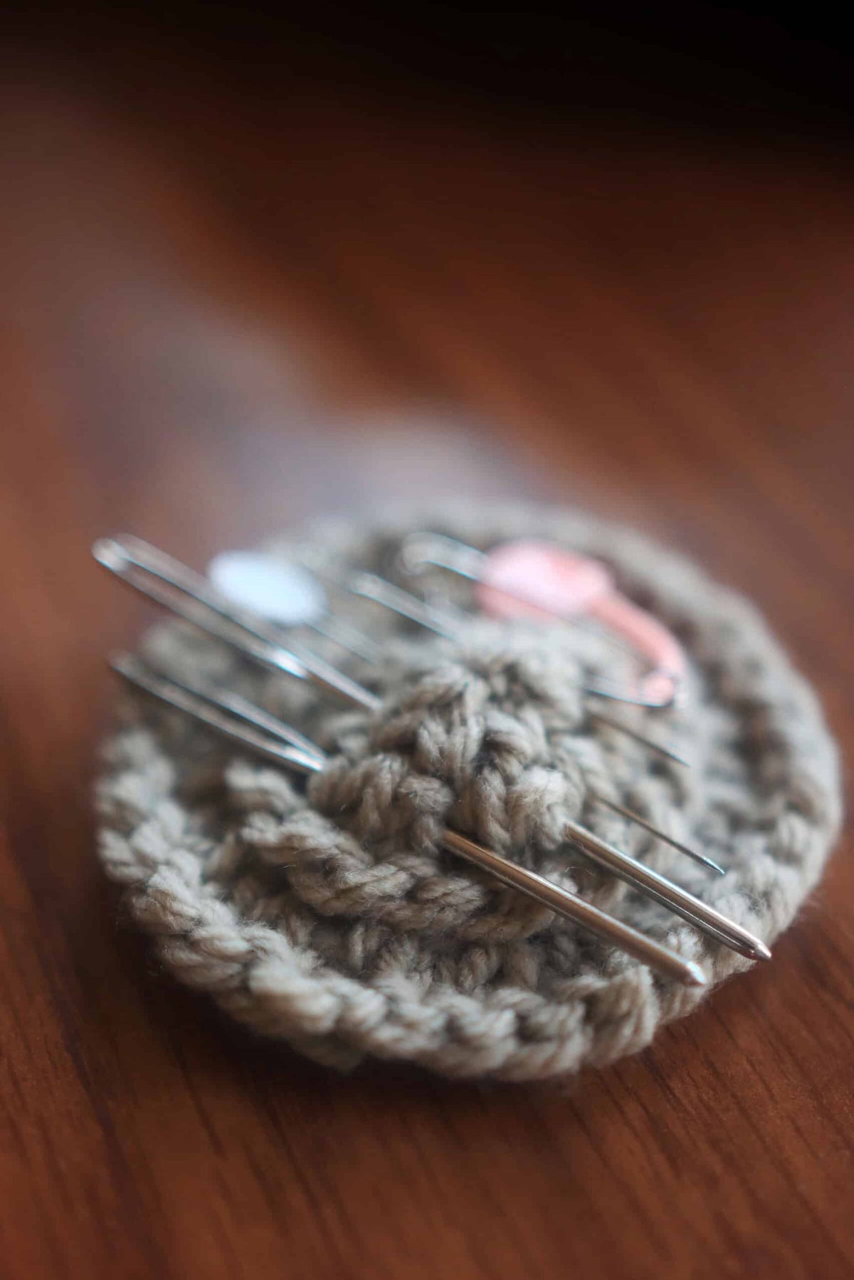 Handknit pincushion pattern with classic timeless aesthetic