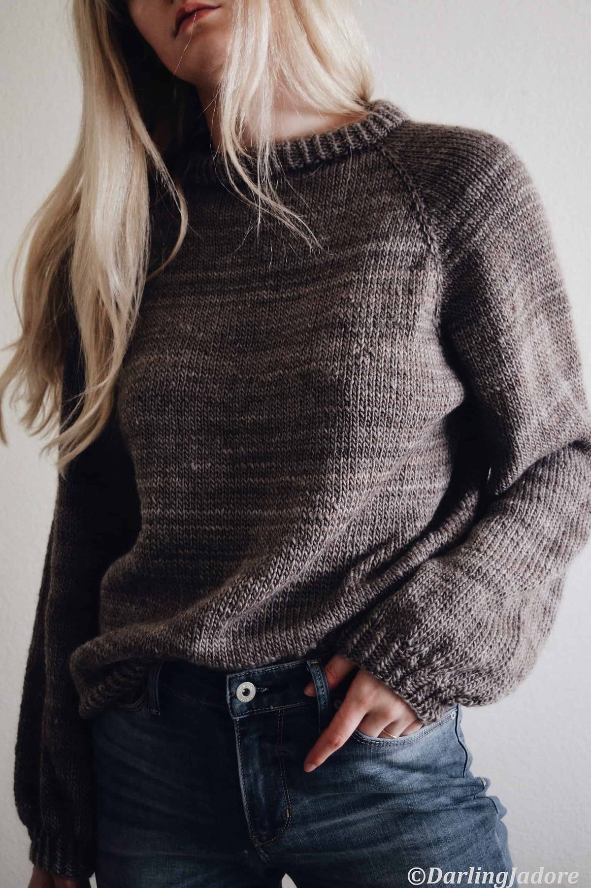 Close-up of Posy sweater showing delicate ribbon tie detail at keyhole back