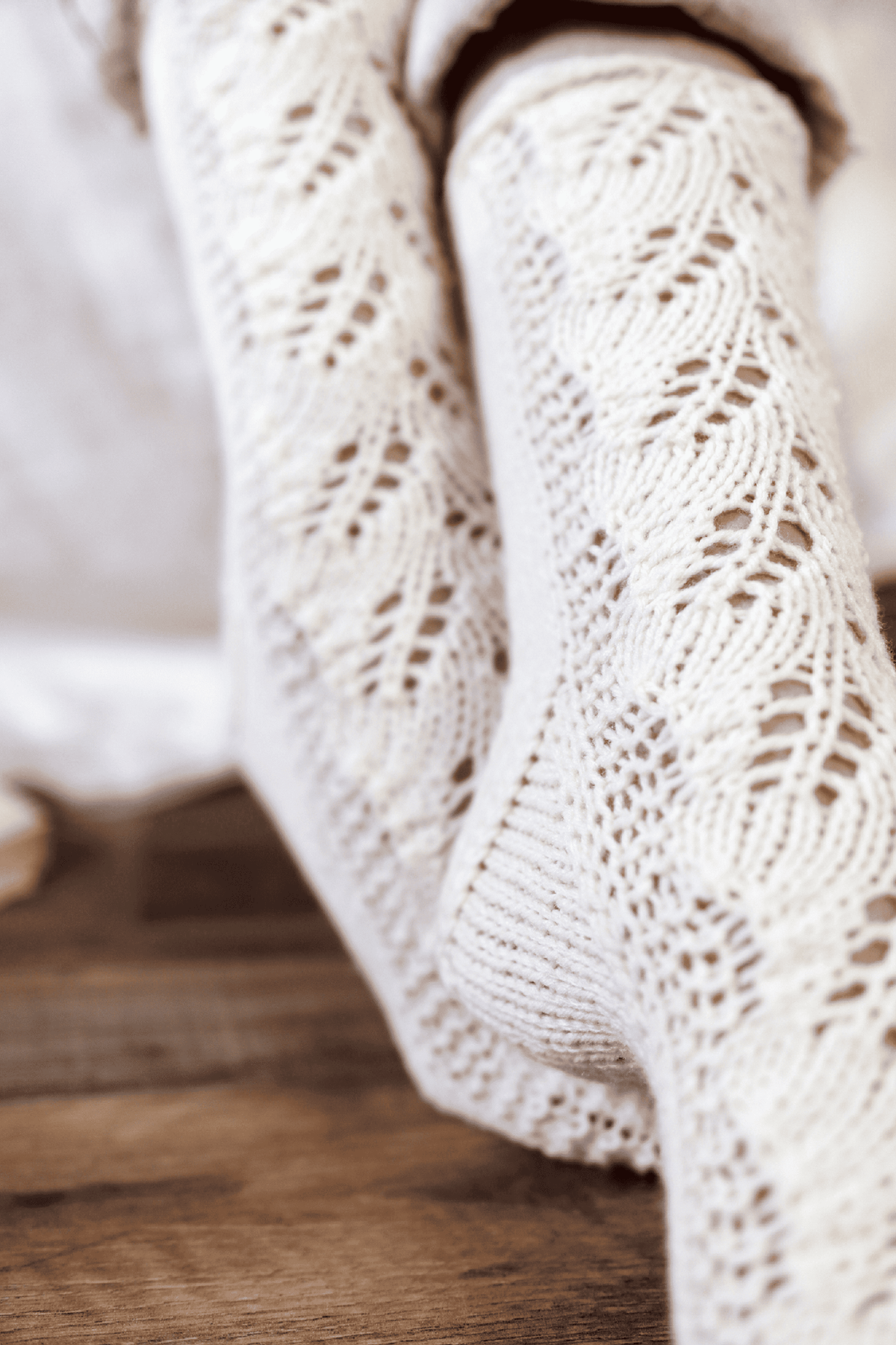 Knitted lace socks in cream yarn with delicate eyelet pattern - Juniper Socks knitting pattern by Darling Jadore