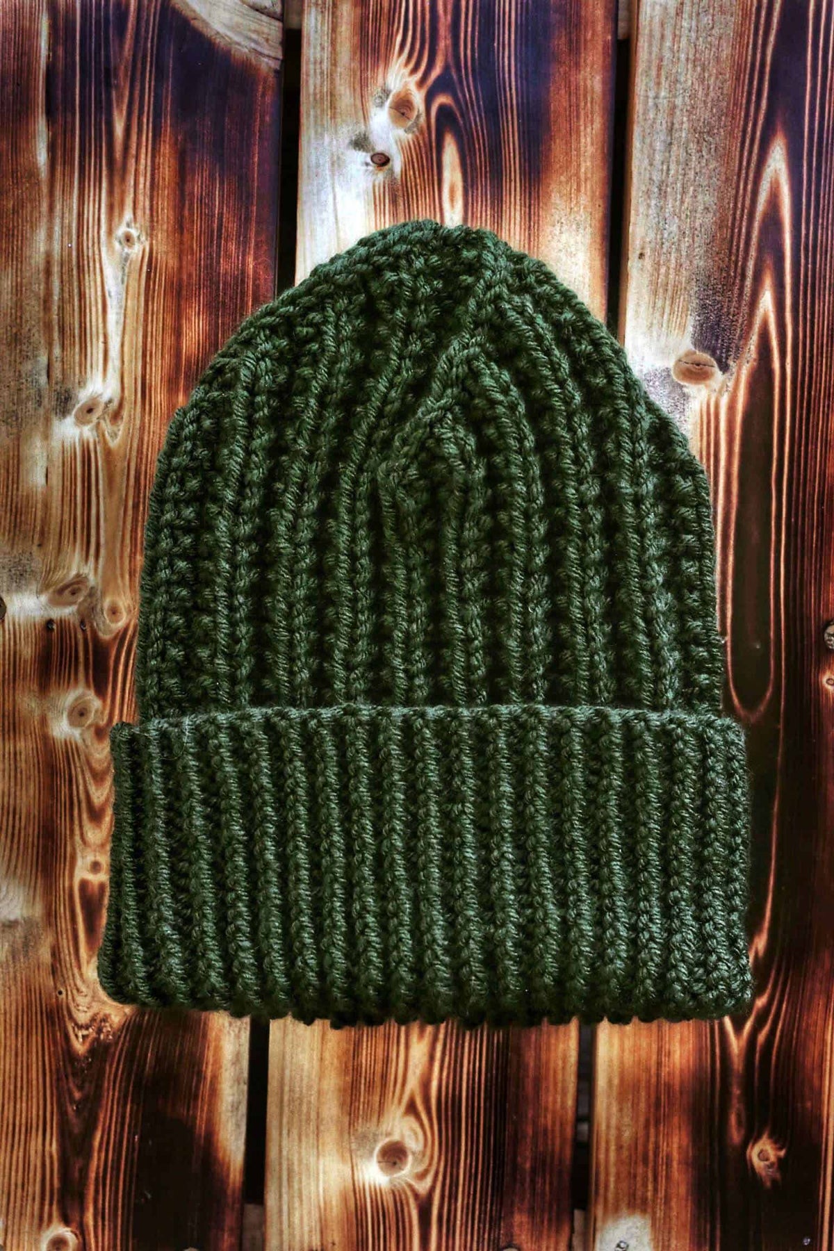 Close up of textured ribbing detail on mens beanie knitting pattern with fold-up brim