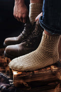 Hand knit men's socks with textured ridges in neutral yarn - Kodiak Socks knitting pattern by Darling Jadore
