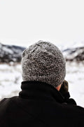 Gray double brim beanie knitting pattern for men modeled outdoors in winter