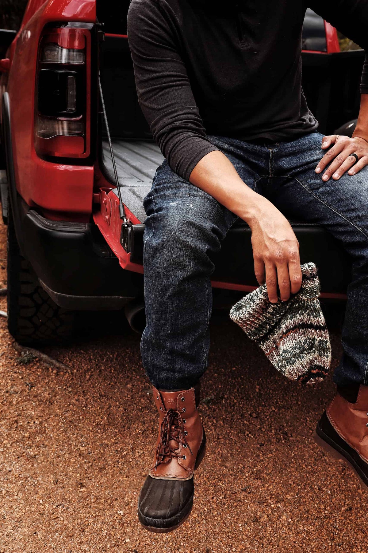Man wearing hand knit camo beanie with classic ribbed texture
