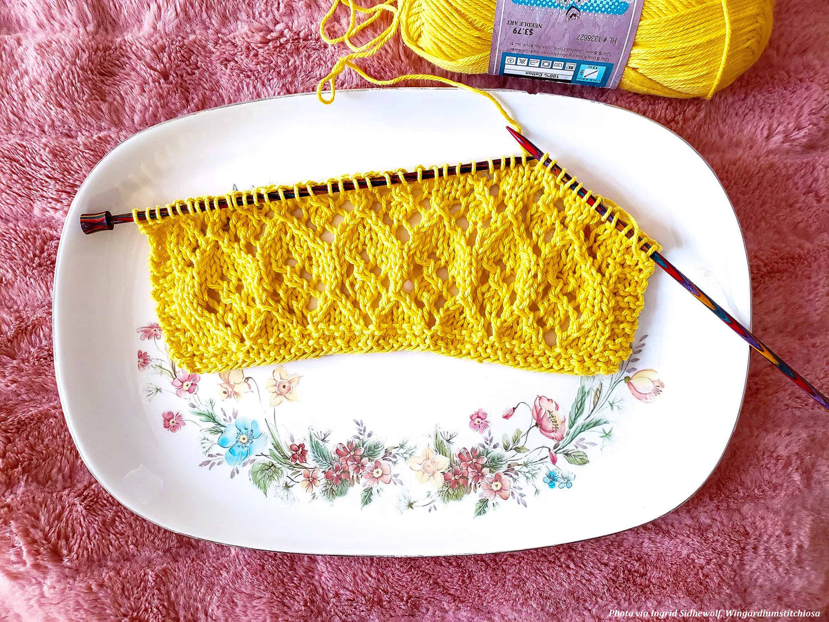 Hand towel knitting pattern featuring elegant lace motifs and modern styling
