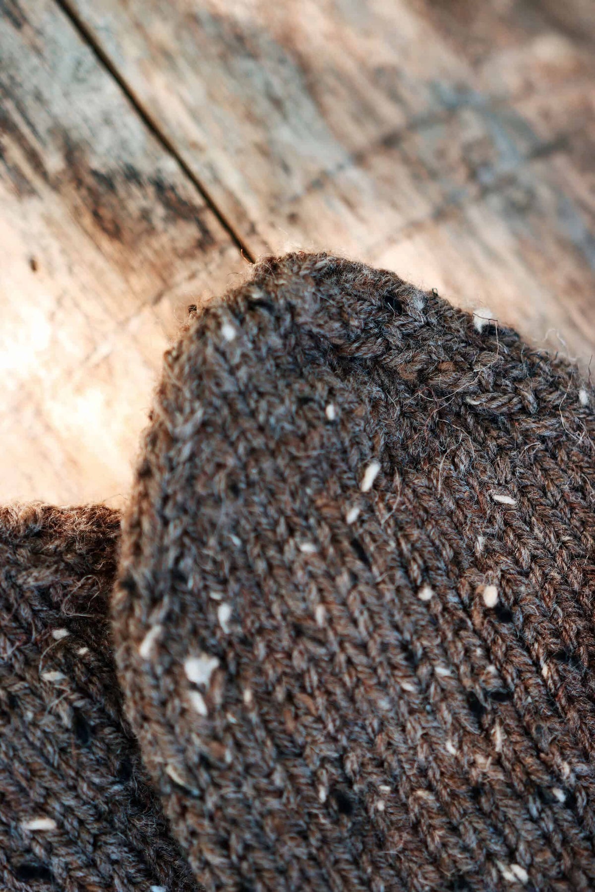 Women's knit mittens pattern featuring timeless design and decorative string