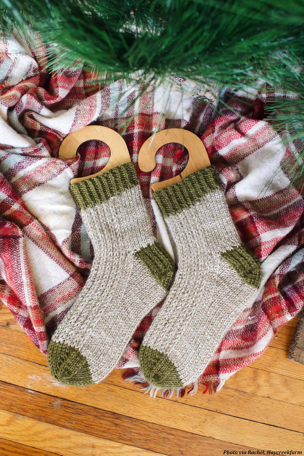 Textured worsted weight socks knitting pattern detail with classic cable and rib stitches