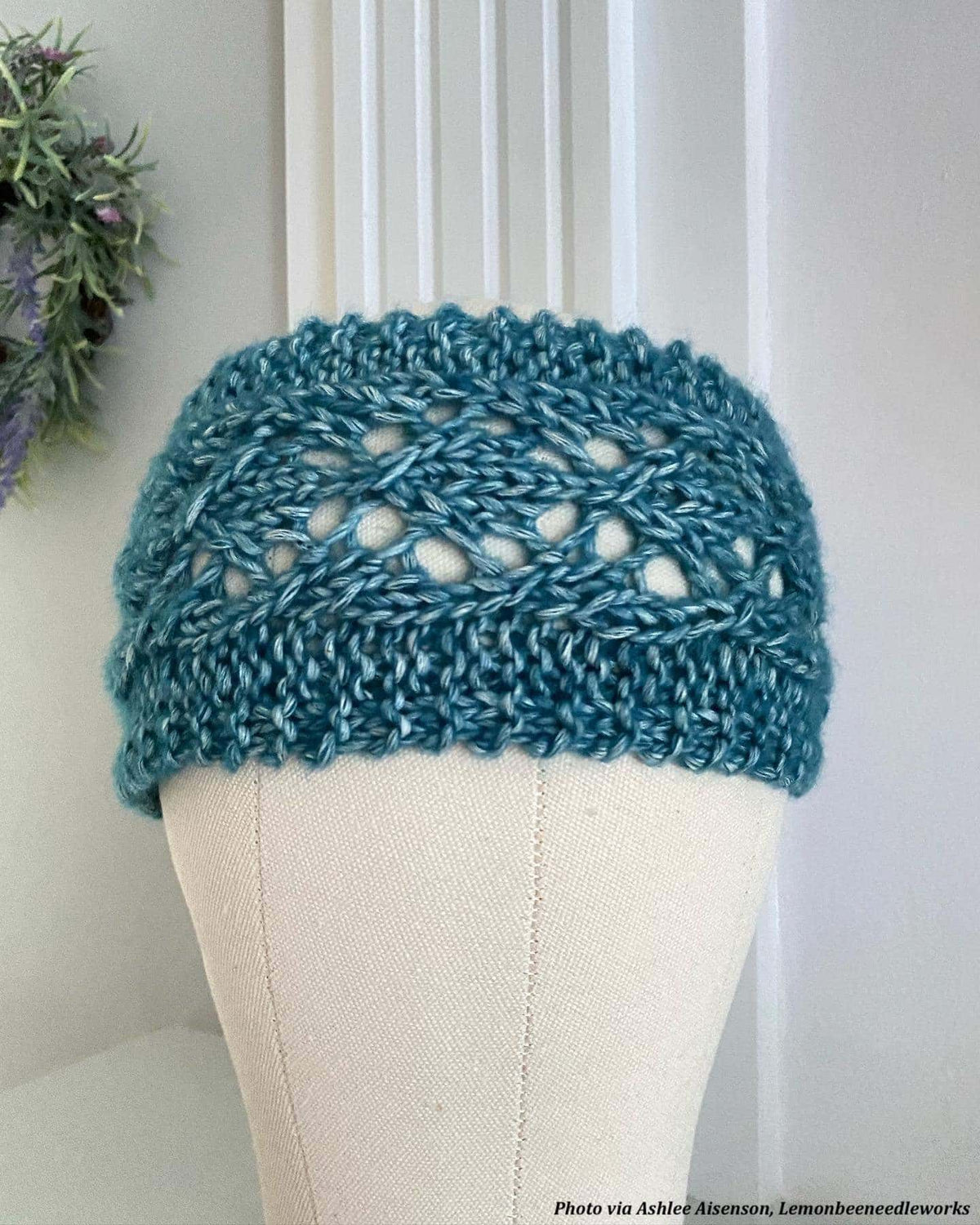 Phlox headband knitting pattern flat lay showing lace detail and classic knit stitches