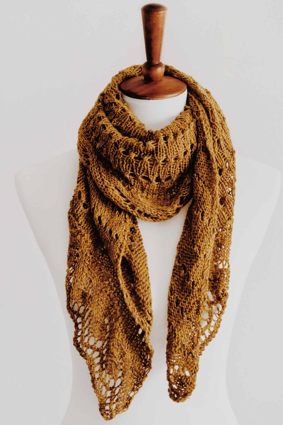 Autumn-inspired mustard shawl knitting pattern with delicate eyelet lace details
