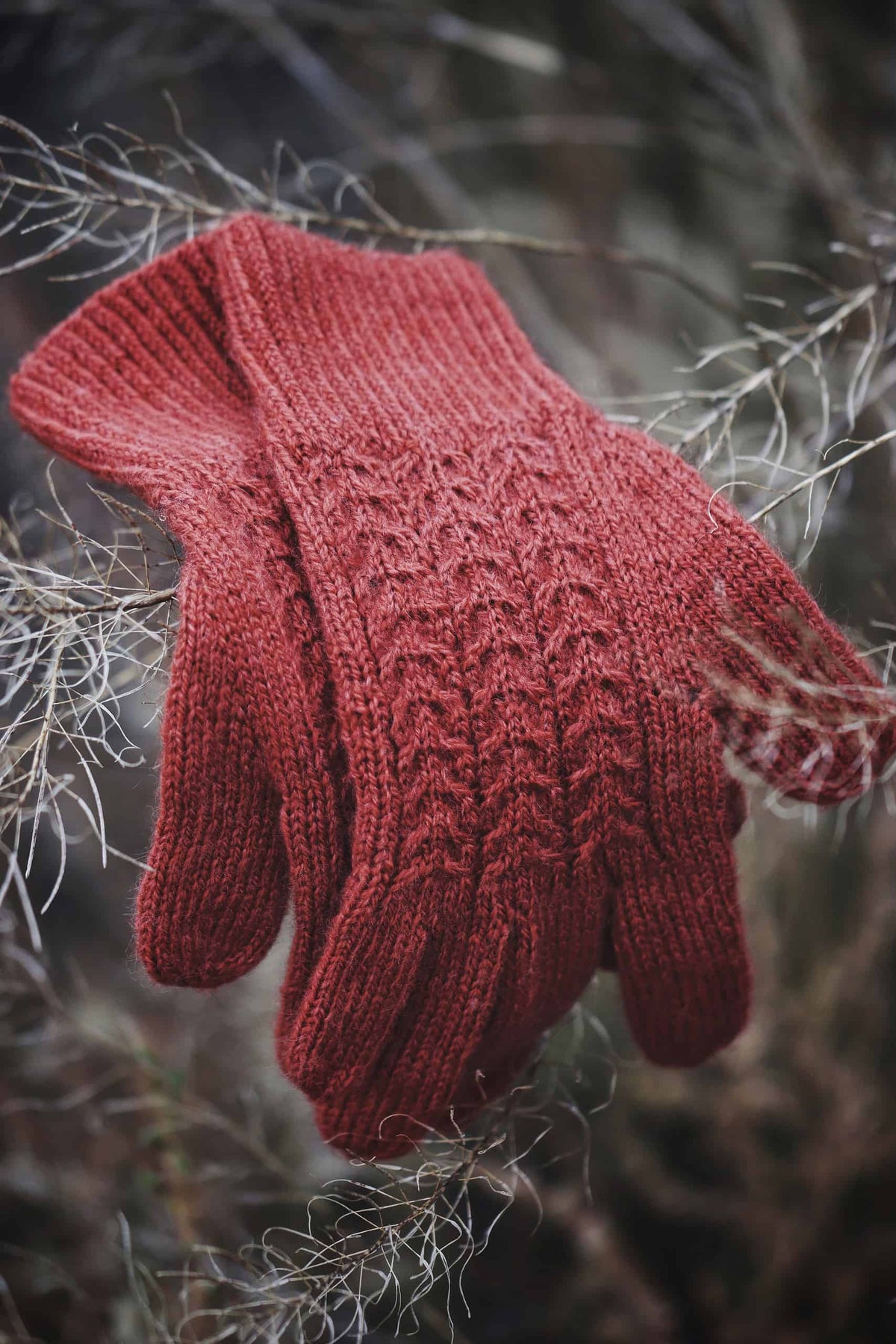Red cable knit gloves pattern with classic cable design perfect for winter warmth