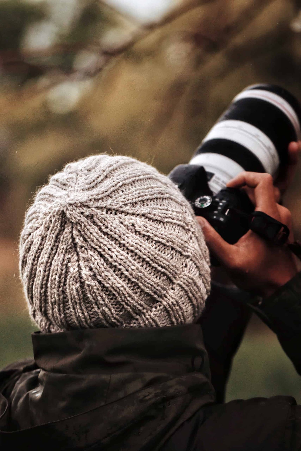 Classic ribbed beanie knitting pattern with double brim worn outdoors in winter
