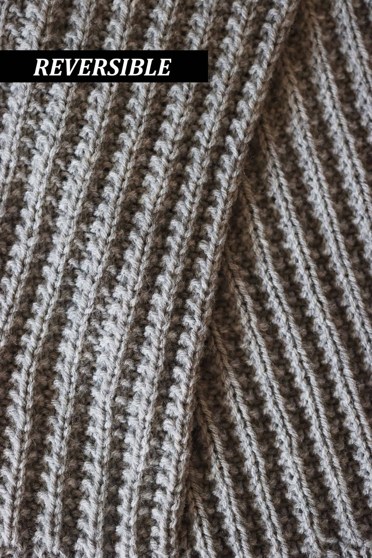 Close-up of elegant ribbed texture in The Mountaineer scarf knitting pattern