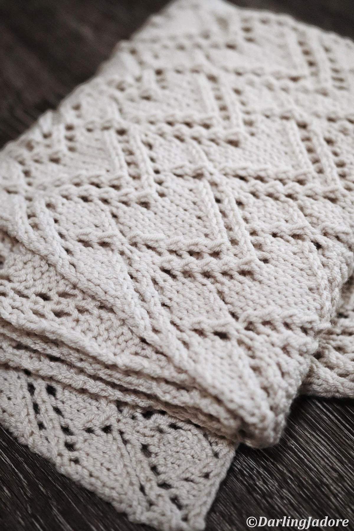 Elegant cream lace scarf draped showing full length and geometric lace detail